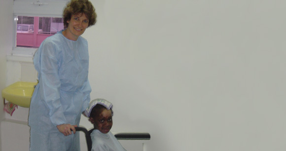 Nurse Julie with a young burn patient